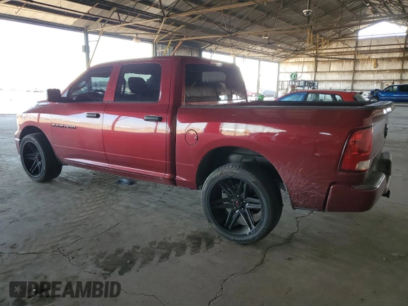2012 Ram 1500 Tradesman with VIN 1C6RD6KP2CS296003, listed as a Copart auction lot 82170314 with 136,216 mi miles and Salvage title. Bid and sale history available at DreamBid. Image 2.