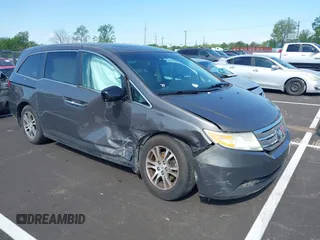 2011 Honda Odyssey EX-L with VIN 5FNRL5H62BB058765, listed as a IAAI auction lot 42017802 with 178,512 mi miles and . Bid and sale history available at carsss.com. Image 1.
