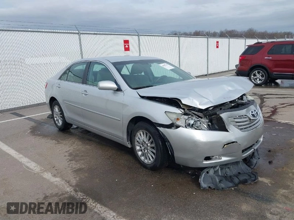 2009 Toyota Camry LE with VIN 4T1BK46K39U581157, listed as a IAAI auction lot 41827143 with 107,664 mi miles. Bid and sale history available at carsss.com. Image 1.
