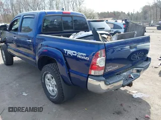 2014 Toyota Tacoma with VIN 3TMLU4EN0EM153558, listed as a IAAI auction lot 41964890 with 140,864 mi miles and . Bid and sale history available at DreamBid. Image 3.