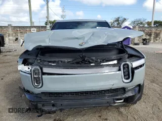 2023 Rivian R1T Adventure with VIN 7FCTGBAA2PN028983, listed as a Copart auction lot 45307015 with 220 mi miles and Salvage Title. Bid and sale history available at DreamBid. Image 5.