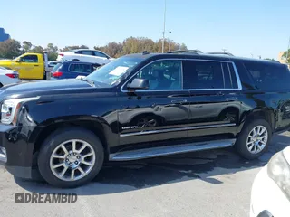 2015 GMC Yukon XL Denali with VIN 1GKS1JKJ1FR134428, listed as a IAAI auction lot 42149588 with 116,207 mi miles. Bid and sale history available at carsss.com. Image 14.
