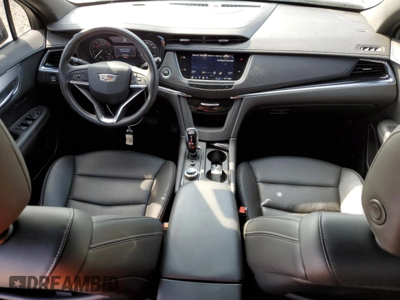 2024 Cadillac XT6 FWD Luxury with VIN 1GYKPAR47RZ705252, listed as a Copart auction lot 49244015 with 26,838 mi miles and Salvage title. Bid and sale history available at DreamBid. Image 8.