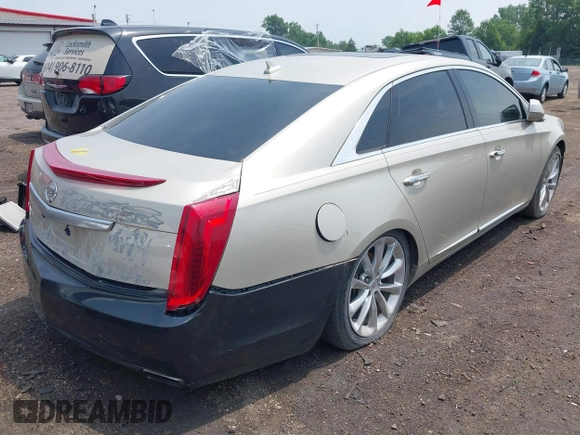2014 Cadillac XTS Luxury z VIN 2G61M5S38E9291182, wystawiony jako IAAI lot #42495838 z przebiegiem 104 941 mil mil oraz . Historia ofert i sprzedaży dostępna na DreamBid. Obrazek 4.