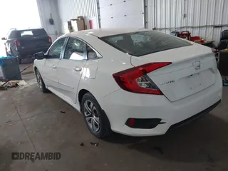 2017 Honda Civic LX with VIN 19XFC2F5XHE007668, listed as a IAAI auction lot 42219927 with 132,444 mi miles and . Bid and sale history available at DreamBid. Image 3.