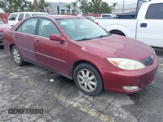 2004 Toyota Camry LE with VIN 4T1BF32K54U069705, listed as a IAAI auction lot 41809582 with 194,606 mi miles. Bid and sale history available at carsss.com. Image 1.