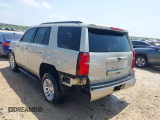 2015 Chevrolet Tahoe LS with VIN 1GNSCAKC9FR294832, listed as a IAAI auction lot 39274877 with 126,932 mi miles and . Bid and sale history available at DreamBid. Image 3.