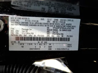2018 Ford Focus SE z VIN 1FADP3FE6JL232769, wystawiony jako Copart lot #87667595 z przebiegiem 124 496 mil mil oraz Szkoda całkowita • Salvage title. Historia ofert i sprzedaży dostępna na DreamBid. Obrazek 14.