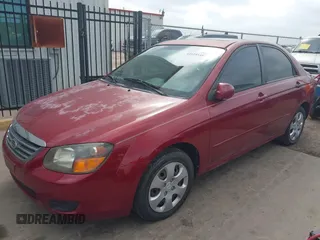 2009 Kia Spectra EX with VIN KNAFE221195606045, listed as a IAAI auction lot 42128548 with 124,577 mi miles. Bid and sale history available at carsss.com. Image 2.