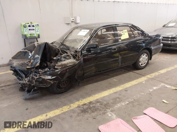1994 Toyota Camry LE with VIN JT2SK12E3R0207215, listed as a IAAI auction lot 41788670 with 124,010 mi miles. Bid and sale history available at carsss.com. Image 2.