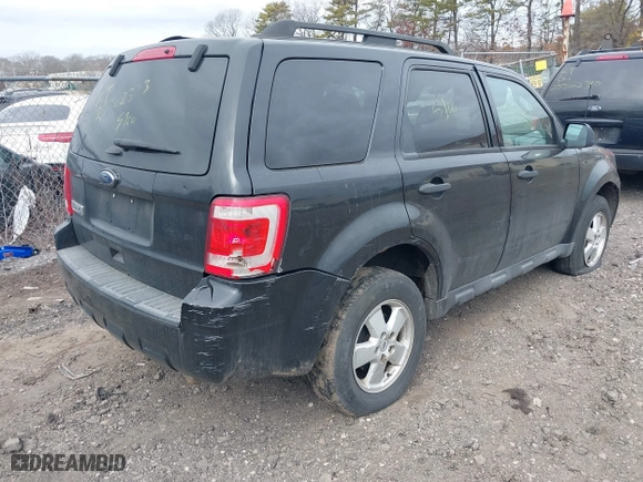 2011 Ford Escape XLT with VIN 1FMCU9D79BKB81857, listed as a IAAI auction lot 41736042 with 999,999 mi miles. Bid and sale history available at carsss.com. Image 4.