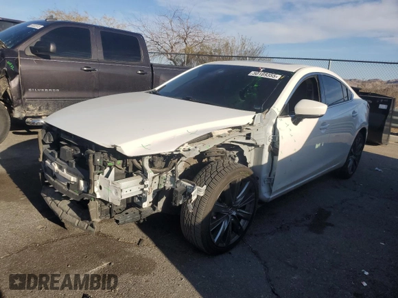 2021 Mazda 6 Touring with VIN JM1GL1VM6M1612064, listed as a Copart auction lot 50189355 with 69,319 mi miles and Salvage Title. Bid and sale history available at DreamBid. Image 1.