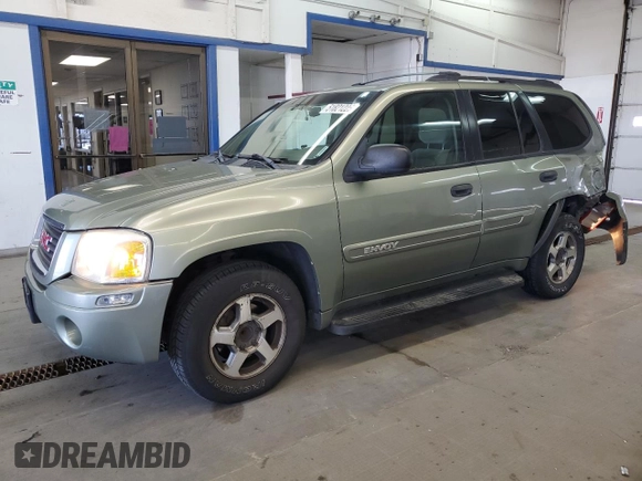 2004 GMC Envoy SLE with VIN 1GKDS13S442417232, listed as a Copart auction lot 51821225 with 242,945 mi miles and Salvage Title. Bid and sale history available at carsss.com. Image 1.