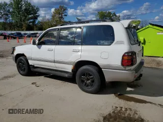 1999 Toyota Land Cruiser with VIN JT3HT05J3X0068111, listed as a Copart auction lot 72815044 with 185,043 mi miles and Clean Title. Bid and sale history available at carsss.com. Image 2.