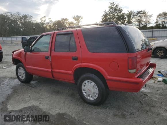 1996 GMC Jimmy SL z VIN 1GKDT13WXT2502347, wystawiony jako Copart lot #74502444 z przebiegiem 253 735 mil mil oraz Szkoda całkowita • Salvage title. Historia ofert i sprzedaży dostępna na DreamBid. Obrazek 2.