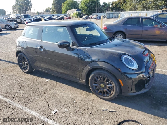 2023 MINI Hardtop 2 Door Cooper SE Signature with VIN WMW13DJ00P2T81586, listed as a Copart auction lot 65493294 with 5,063 mi miles and Salvage Title. Bid and sale history available at carsss.com. Image 4.