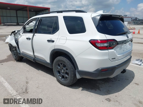 2024 Honda Pilot TrailSport z VIN 5FNYG1H6XRB004763, wystawiony jako IAAI lot #42237606 z przebiegiem 14 819 mil mil oraz . Historia ofert i sprzedaży dostępna na DreamBid. Obrazek 3.
