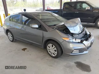 2013 Honda Insight LX z VIN JHMZE2H51DS006726, wystawiony jako IAAI lot #42094169 z przebiegiem 165 087 mil mil oraz . Historia ofert i sprzedaży dostępna na DreamBid. Obrazek 1.