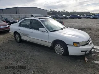 1996 Honda Accord EX with VIN 1HGCD5657TA001356, listed as a Copart auction lot 69712964 with 241,689 mi miles and Salvage Title. Bid and sale history available at carsss.com. Image 4.