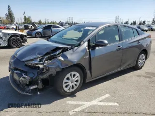 2019 Toyota Prius L Eco z VIN JTDKARFUXK3076282, wystawiony jako Copart lot #54001915 z przebiegiem 52 313 mil mil oraz Szkoda całkowita • Salvage title. Historia ofert i sprzedaży dostępna na DreamBid. Obrazek 1.