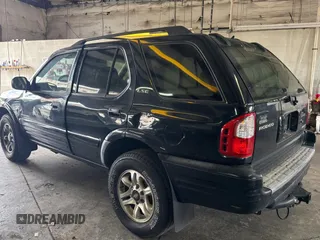 2002 Isuzu Rodeo S with VIN 4S2CK58W124336947, listed as a Copart auction lot 63482935 with 248,008 mi miles and Clean title. Bid and sale history available at DreamBid. Image 3.
