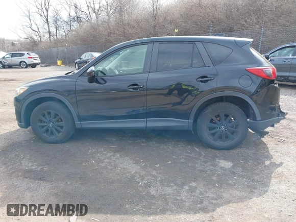 2015 Mazda CX-5 Touring with VIN JM3KE4CY2F0445178, listed as a IAAI auction lot 41828953 with 137,330 mi miles and . Bid and sale history available at DreamBid. Image 15.