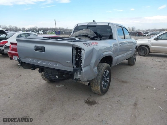 2019 Toyota Tacoma 4WD SR5 with VIN 3TMDZ5BN9KM061604, listed as a IAAI auction lot 41274995 with 87,834 mi miles. Bid and sale history available at carsss.com. Image 4.