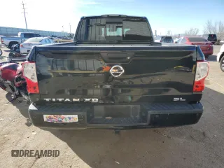2017 Nissan Titan SL z VIN 1N6BA1F20HN522403, wystawiony jako Copart lot #87477114 z przebiegiem 98 084 mil mil oraz Szkoda całkowita • Salvage title. Historia ofert i sprzedaży dostępna na DreamBid. Obrazek 6.