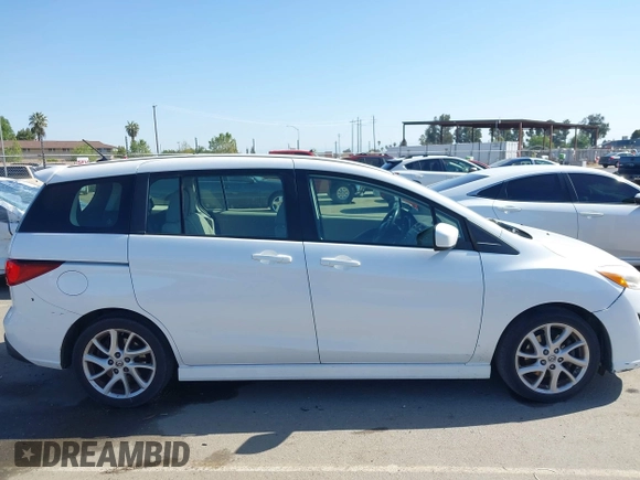 2012 Mazda 5 Touring with VIN JM1CW2CL7C0140452, listed as a IAAI auction lot 41970209 with 92,069 mi miles and . Bid and sale history available at DreamBid. Image 14.
