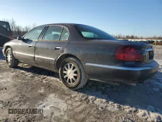 1999 Lincoln Continental with VIN 1LNHM97V2XY719495, listed as a Copart auction lot 42239665 with 234,544 mi miles and Salvage Title. Bid and sale history available at carsss.com. Image 2.