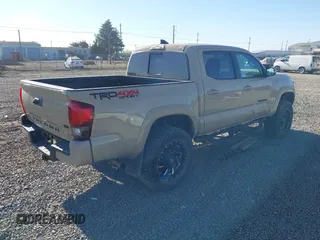2018 Toyota Tacoma SR z VIN 3TMCZ5AN7JM125425, wystawiony jako IAAI lot #40459066 z przebiegiem 85 182 mil mil oraz . Historia ofert i sprzedaży dostępna na DreamBid. Obrazek 4.