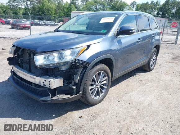 2019 Toyota Highlander SE with VIN 5TDKZRFH1KS290412, listed as a IAAI auction lot 42272229 with 74,212 mi miles and . Bid and sale history available at DreamBid. Image 2.