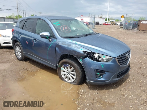 2016 Mazda CX-5 Touring z VIN JM3KE2CY3G0728968, wystawiony jako IAAI lot #42189174 z przebiegiem 145 977 mil mil oraz . Historia ofert i sprzedaży dostępna na DreamBid. Obrazek 1.