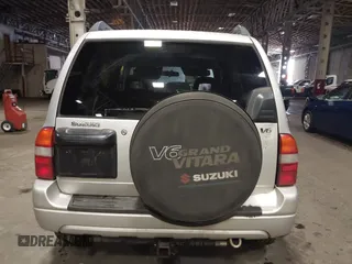 2002 Suzuki Grand Vitara JLX z VIN JS3TD62V324161291, wystawiony jako IAAI lot #41577344 z przebiegiem 164 658 mil mil oraz . Historia ofert i sprzedaży dostępna na DreamBid. Obrazek 16.