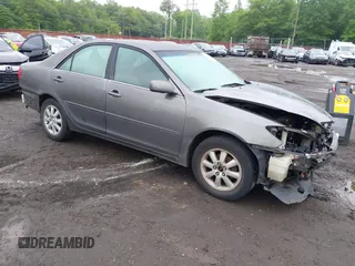 2004 Toyota Camry LE z VIN 4T1BE32K64U911938, wystawiony jako IAAI lot #42384129 z przebiegiem 310 337 mil mil oraz . Historia ofert i sprzedaży dostępna na DreamBid. Obrazek 1.