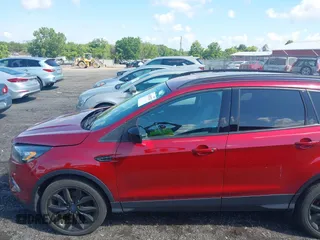 2017 Ford Escape SE z VIN 1FMCU9GD4HUA10240, wystawiony jako IAAI lot #42392522 z przebiegiem 82 325 mil mil oraz . Historia ofert i sprzedaży dostępna na DreamBid. Obrazek 14.