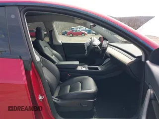 2021 Tesla Model Y Long Range with VIN 5YJYGDEE0MF209191, listed as a IAAI auction lot 41937507 with 56,131 mi miles. Bid and sale history available at carsss.com. Image 5.