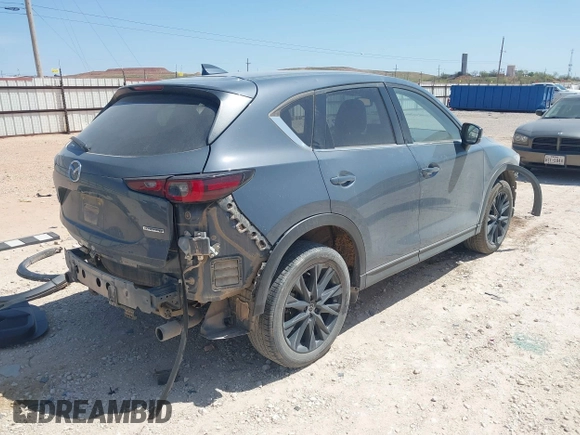 2023 Mazda CX-5 S Carbon Edition z VIN JM3KFBCM7P0164462, wystawiony jako IAAI lot #41919579 z przebiegiem 49 585 mil mil oraz . Historia ofert i sprzedaży dostępna na DreamBid. Obrazek 4.