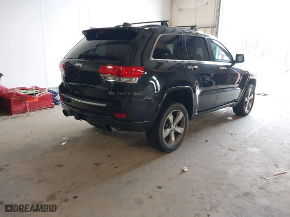 2014 Jeep Grand Cherokee Overland with VIN 1C4RJFCM4EC386398, listed as a IAAI auction lot 41696113 with 119,110 mi miles. Bid and sale history available at carsss.com. Image 4.