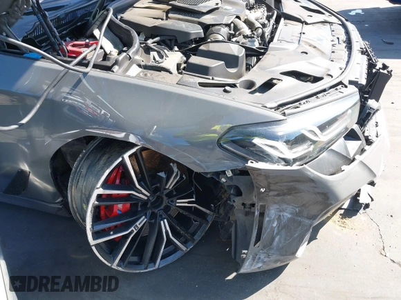 2022 BMW 5 Series M550i xDrive with VIN WBA13BK02NCJ61943, listed as a IAAI auction lot 41607980 with Not provided miles and . Bid and sale history available at DreamBid. Image 6.