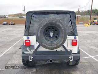 2001 Jeep Wrangler Sport with VIN 1J4FA49S41P308407, listed as a IAAI auction lot 41772240 with 139,461 mi miles. Bid and sale history available at carsss.com. Image 16.