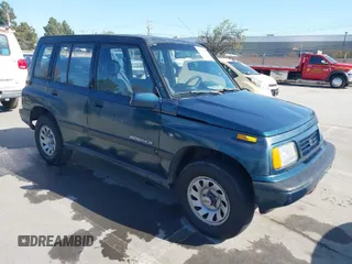1995 Suzuki Sidekick z VIN JS3TD03V1S4114529, wystawiony jako IAAI lot #41953532 z przebiegiem 265 408 mil mil oraz . Historia ofert i sprzedaży dostępna na DreamBid. Obrazek 1.