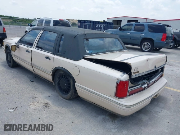 1997 Lincoln Town Car Cartier with VIN 1LNLM83W8VY627663, listed as a IAAI auction lot 42392454 with 209,440 mi miles and . Bid and sale history available at DreamBid. Image 3.