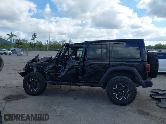 2023 Jeep Wrangler Rubicon with VIN 1C4HJXFGXPW534515, listed as a IAAI auction lot 41524419 with 21,376 mi miles and . Bid and sale history available at DreamBid. Image 14.
