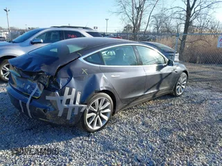 2020 Tesla Model 3 Long Range with VIN 5YJ3E1EB9LF795408, listed as a IAAI auction lot 41735428 with 56,013 mi miles. Bid and sale history available at carsss.com. Image 4.