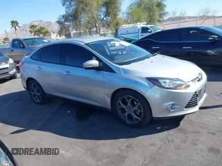 2013 Ford Focus SE z VIN 1FADP3F26DL273235, wystawiony jako IAAI lot #41674528 z przebiegiem 177 117 mil mil oraz . Historia ofert i sprzedaży dostępna na DreamBid. Obrazek 1.