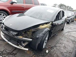 2019 Tesla Model 3 Mid Range with VIN 5YJ3E1EA1KF357522, listed as a IAAI auction lot 41025245 with 130,018 mi miles. Bid and sale history available at carsss.com. Image 18.