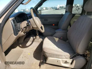 1999 Toyota Tacoma z VIN 4TAWN72N5XZ418522, wystawiony jako Copart lot #51940615 z przebiegiem 340 432 mil mil oraz Szkoda całkowita • Salvage title. Historia ofert i sprzedaży dostępna na DreamBid. Obrazek 7.