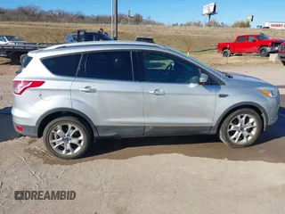 2014 Ford Escape Titanium with VIN 1FMCU0JX7EUC59643, listed as a IAAI auction lot 41082952 with 143,899 mi miles. Bid and sale history available at carsss.com. Image 14.