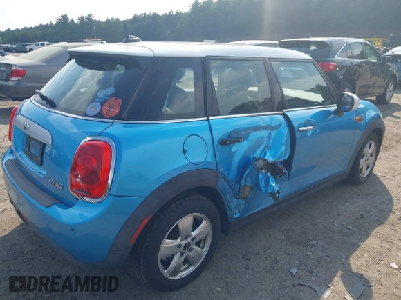 2015 MINI Hardtop 4 Door z VIN WMWXS5C51FT829693, wystawiony jako IAAI lot #42497639 z przebiegiem 36 494 mil mil oraz . Historia ofert i sprzedaży dostępna na DreamBid. Obrazek 4.
